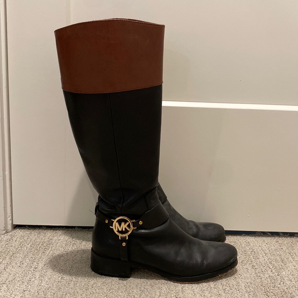 Black and brown leather riding boots by Michael Kors